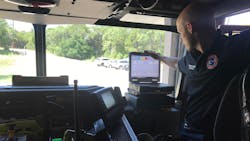 CE-Bar Fire Department Lt. Brandon Burns demonstrates the truck&apos;s on-board GPS and computer system that details the emergency and its location.