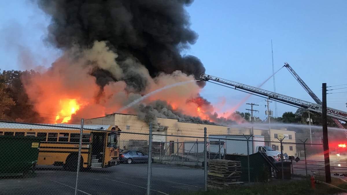 Columbus, OH, firefighters battle a two-alarm fire at an industrial building on the city&apos;s near east side Friday night.