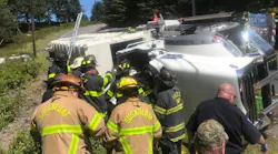 Hazle Township, PA, firefighters rescued a driver Monday who was trapped inside an overturned recycling collection truck.