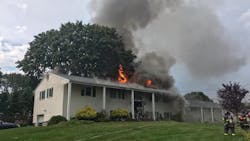 A Norwalk, CT, firefighter was injured when he was knocked temporarily unconscious Monday by a section of falling ceiling while battling a house fire.