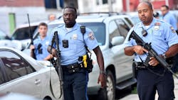 Philadelphia police respond to a shooting Wednesday in which six officers were wounded in a standoff with a gunman that prompted a massive law enforcement response in the city&apos;s Nicetown-Tioga neighborhood.