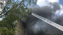 Two Pittsburgh firefighters were injured battling a five-alarm blaze at an apartment complex Saturday.