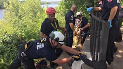 St. Paul, MN, firefighters used ropes to pull up a teen who fell 15 to 20 feet down a Mississippi River bluff Wednesday. St. Paul, MN, firefighters used ropes to pull up a teen who fell 15 to 20 feet down a Mississippi River bluff Wednesday.