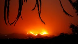 The Thomas wildfire burns back down the hill behind East Valley Road by Ladera Lane near Toro Canyon in Montecito, CA, on Dec. 12, 2017