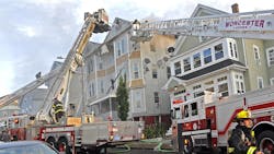 Worcester, MA, firefighters battle the four-alarm fire Thursday in the three-decker at 63 Harrison St. Worcester, MA, firefighters battle the four-alarm fire Thursday in the three-decker at 63 Harrison St.