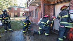 Firefighters prepare to enter a building for the Aggressive Fire Control, Flow Path, and VES Tactics HOT program. Firefighters prepare to enter a building for the Aggressive Fire Control, Flow Path, and VES Tactics HOT program.