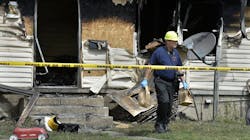 Erie Police Detective Lt. Chris Crawford carries possible evidence from a home at 1248 West 11th St. where five children died in an early morning fire on Sunday, Aug. 11, 2019. Erie Police Detective Lt. Chris Crawford carries possible evidence from a home at 1248 West 11th St. where five children died in an early morning fire on Sunday, Aug. 11, 2019.