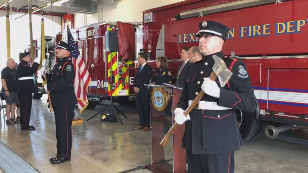 The flag is presented during a ribbon cutting ceremony to open a new fire station in Lexington, KY, on Tuesday, Aug. 20, 2019.