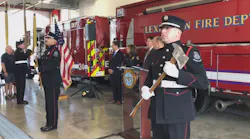 The flag is presented during a ribbon cutting ceremony to open a new fire station in Lexington, KY, on Tuesday, Aug. 20, 2019.