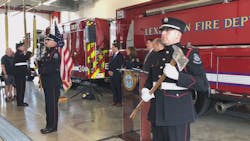 The flag is presented during a ribbon cutting ceremony to open a new fire station in Lexington, KY, on Tuesday, Aug. 20, 2019.