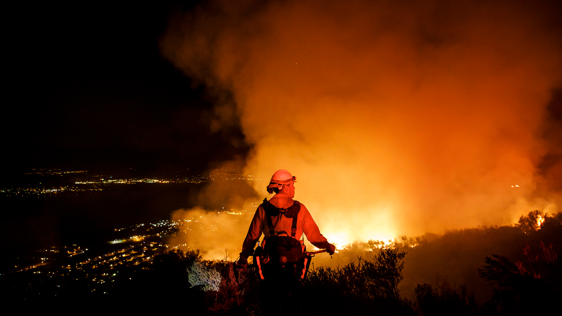 Firefighters watch for flare ups from the Holy Fire in Lake Elsinore, CA, on Aug. 10, 2018.