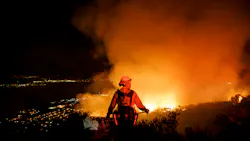 Firefighters watch for flare ups from the Holy Fire in Lake Elsinore, CA, on Aug. 10, 2018.