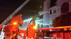 About 100 Dallas firefighters battled a four-alarm blaze that broke out when a utility pole collapsed into a three-story apartment complex Monday night.