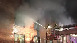 FDNY crews battle a four-alarm warehouse fire in Brooklyn early Thursday. Five firefighters were injured in the blaze.