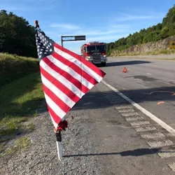 A flag and memorial was erected near the site of the two-vehicle accident in Powell Mountain, WV, that killed two Jan-Care Ambulance Service EMTs on Saturday. A flag and memorial was erected near the site of the two-vehicle accident in Powell Mountain, WV, that killed two Jan-Care Ambulance Service EMTs on Saturday.
