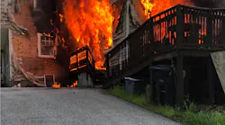Two Nashau, NH, firefighters suffered minor injuries battling a three-alarm blaze Sunday.