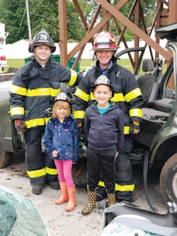 Firefighter Jared Kirchner (l.) and Lt. Dana Paduano taking time out to pose for a photo at the annual open house.