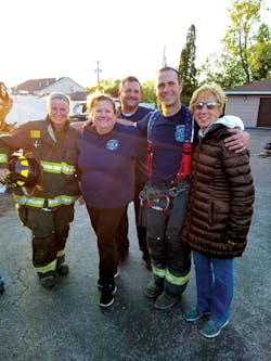 Firefighter Courtney Flagler (l.) and Lt. Jason Sullivan (second from r.) with members of the Citizen&rsquo;s Fire Academy after rope training.