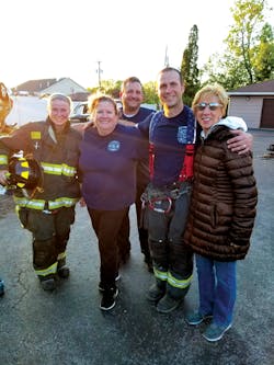 Firefighter Courtney Flagler (l.) and Lt. Jason Sullivan (second from r.) with members of the Citizen’s Fire Academy after rope training. Firefighter Courtney Flagler (l.) and Lt. Jason Sullivan (second from r.) with members of the Citizen’s Fire Academy after rope training.