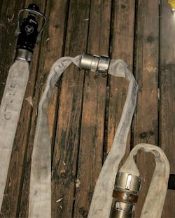 Ensure the nozzle and 50-foot coupling are at the entry point to provide the necessary working line. Ensure the nozzle and 50-foot coupling are at the entry point to provide the necessary working line.