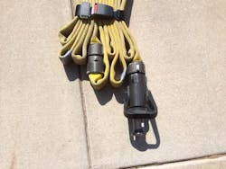 The completed ends of the bundle. The visual indicators (nozzle, tape, and coupling) make it easy to see what parts of the bundle to grab for quick deployment. The completed ends of the bundle. The visual indicators (nozzle, tape, and coupling) make it easy to see what parts of the bundle to grab for quick deployment.