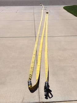 A bundle that was forward stretched. The bundle was dropped, straps broken, and the nozzle and coupling walked up to the point of entry. A bundle that was forward stretched. The bundle was dropped, straps broken, and the nozzle and coupling walked up to the point of entry.