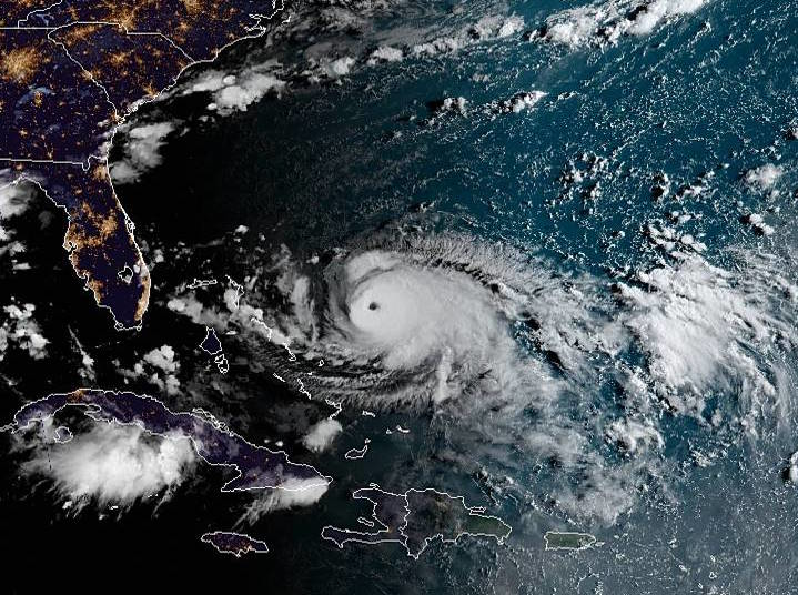 The center of Dorian was moving closer to the Bahamas Saturday morning, and an eye was now easily visible in satellite images.