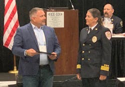 Chief Witner receiving her award from Robbi King of TargetSolutions.