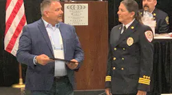 Chief Witner receiving her award from Robbi King of TargetSolutions.