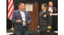 Chief Witner receiving her award from Robbi King of TargetSolutions.