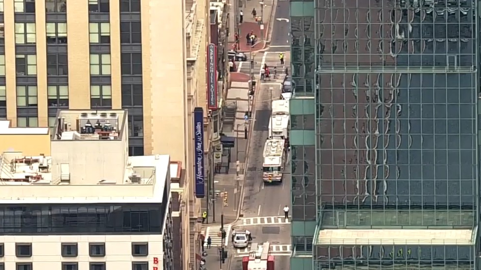 Baltimore firefighters and police evacuated several downtown office buildings, restaurants and hotels after a suspicious van leaking fuel was discovered in a parking garage near the T. Rowe Price building Monday.