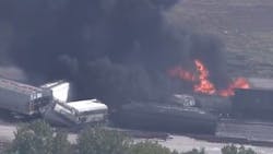 Firefighters tackled a fire that broke out following a train derailment in Dupo, IL, on Tuesday.