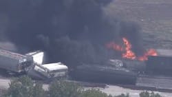 Firefighters tackled a fire that broke out following a train derailment in Dupo, IL, on Tuesday. Firefighters tackled a fire that broke out following a train derailment in Dupo, IL, on Tuesday.