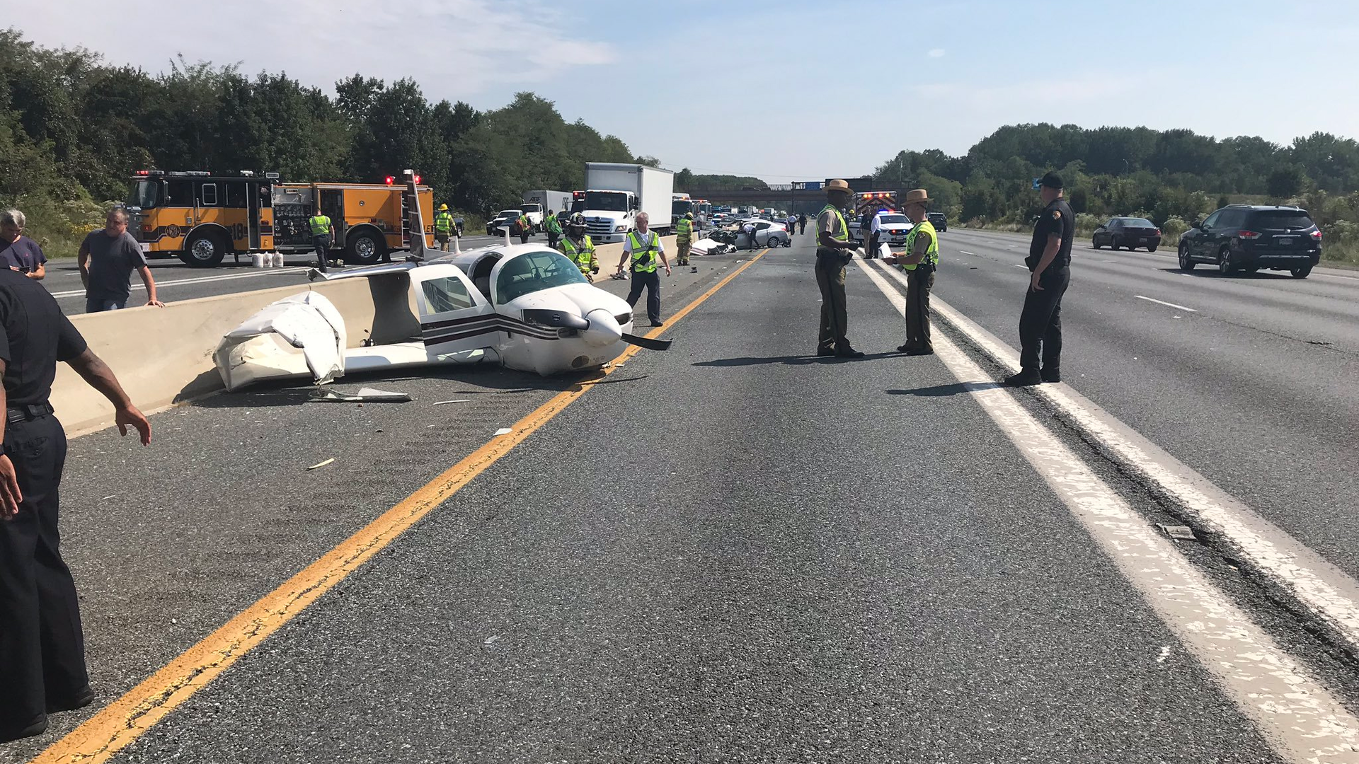 Four people were injured when a small airplane crashed onto a roadway Thursday in Bowie, MD, injuring four people.
