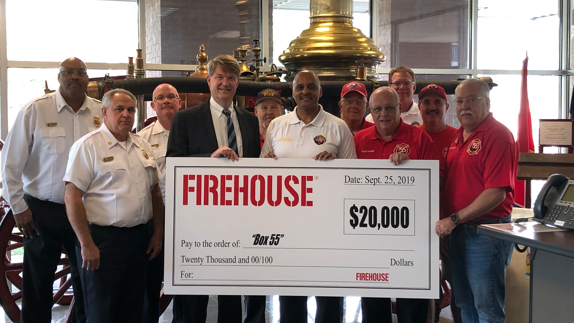 Nashville Fire Department Director Chief Williams Swann with Endeavor Business Media CEO Chris Ferrell with Nashville FD command staff, and Box 55 President Buck Dozier and Box 55 members.