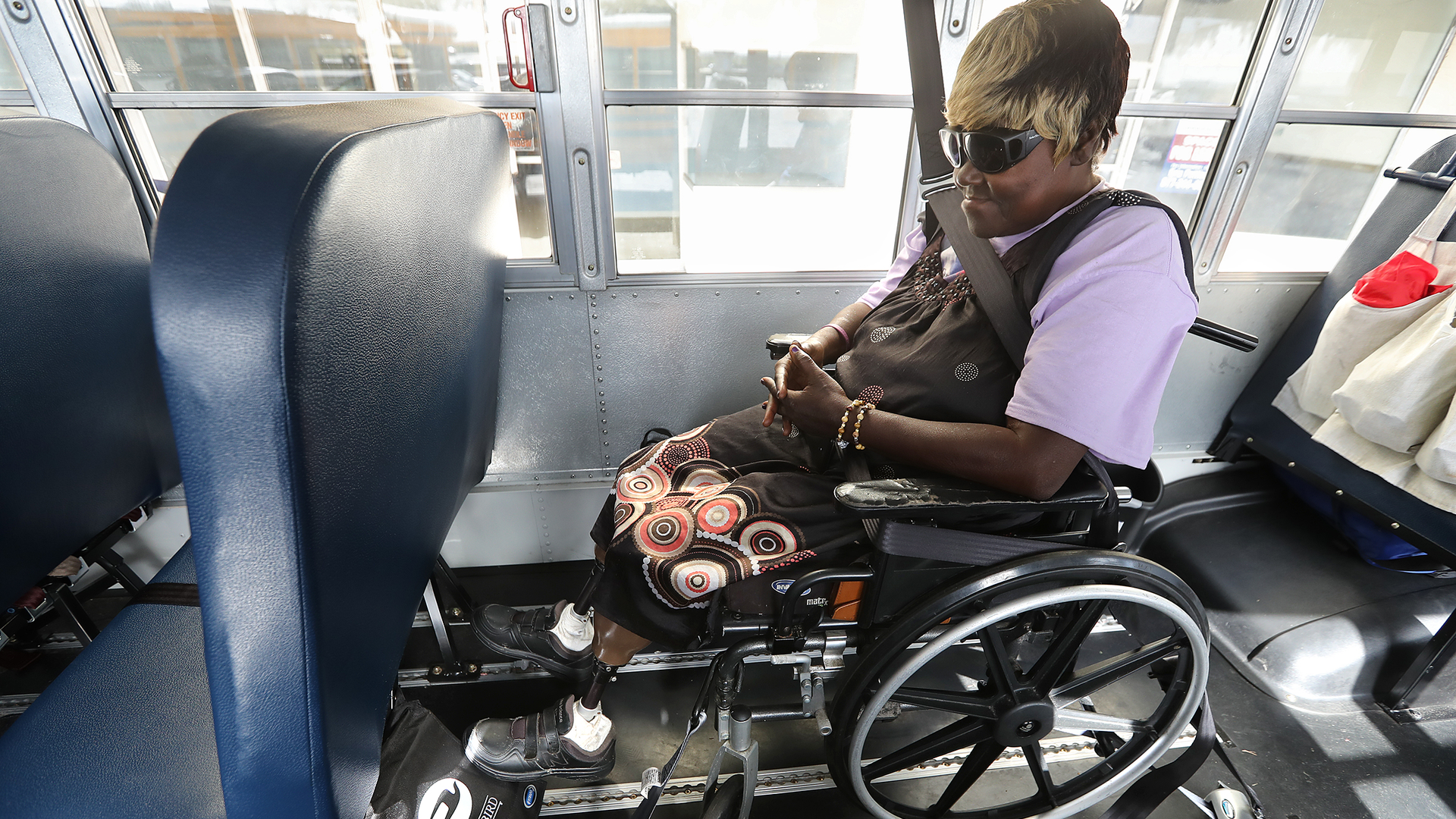Brunswick, GA, resident Theresa Cooper, 56, waits on one of the final buses at Lanier Plaza to evacuate from Hurricane Dorian to Columbus on Tuesday.