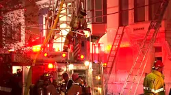 Dozens of Cincinnati firefighters battled a four-alarm blaze that spread to five homes in the city's CUF neighborhood early Monday.