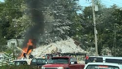 A possible propane explosion Monday in Farmington, ME, killed one firefighter and injured six others.