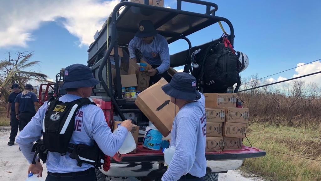 Miami-Dade firefighters help bring the first food and water to isolated areas of Grand Bahama Island in the aftermath of Hurricane Dorian.
