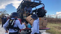 Miami-Dade firefighters help bring the first food and water to isolated areas of Grand Bahama Island in the aftermath of Hurricane Dorian.