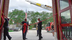 Monroe, MI, Fire Chief Rob Wright (left) and Mayor Robert E. Clark participate in the dedication ceremony of the city's new central fire station Monday.