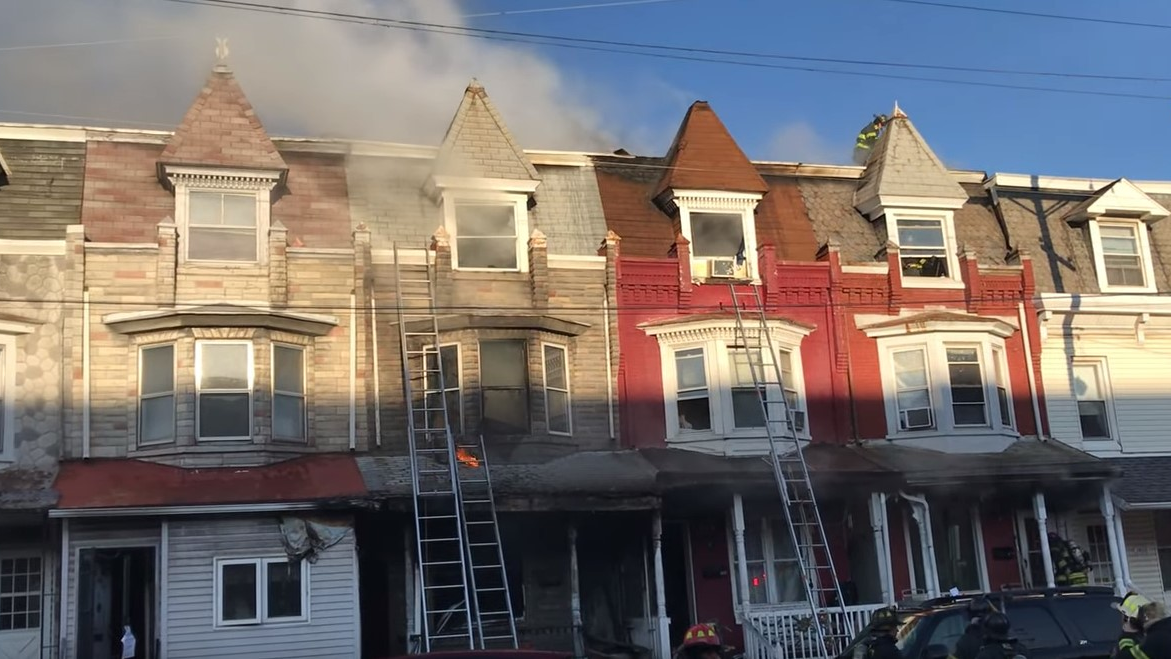 Reading, PA, firefighters, as well as crews from two suburban departments, needed to play catchup with a three-alarm fire that went undiscovered inside a vacant row house before spreading to three neighboring homes Friday.