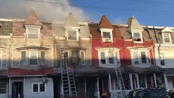 Reading, PA, firefighters, as well as crews from two suburban departments, needed to play catchup with a three-alarm fire that went undiscovered inside a vacant row house before spreading to three neighboring homes Friday.