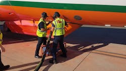 CAL FIRE personnel load 3,000 gallons of flame retardant into an air tanker sent to fly over the Red Bank wildfire in rural Tehama County, CA, on Thursday.