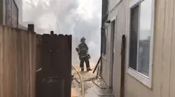 A Sacramento, CA, firefighter suffered minor burns battling a two-alarm fire Wednesday.