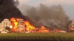 Surf City, NC, firefighters battled a massive blaze that destroyed or damaged at least seven homes Sunday. Surf City, NC, firefighters battled a massive blaze that destroyed or damaged at least seven homes Sunday.