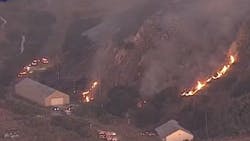 Firefighters from multiple agencies battled a five-alarm grass fire that threatened an historic Mare Island, CA, cemetery Thursday. Firefighters from multiple agencies battled a five-alarm grass fire that threatened an historic Mare Island, CA, cemetery Thursday.