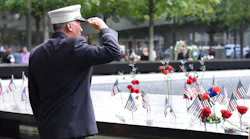 A firefighter salutes the fallen at the 9/11 Memorial in lower Manhattan on Wednesday, Sept. 11, 2019.