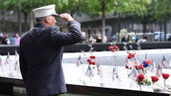 A firefighter salutes the fallen at the 9/11 Memorial in lower Manhattan on Wednesday, Sept. 11, 2019. A firefighter salutes the fallen at the 9/11 Memorial in lower Manhattan on Wednesday, Sept. 11, 2019.