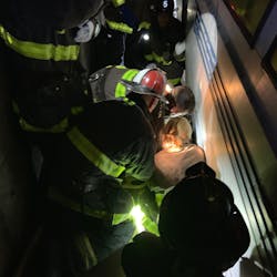 San Francisco firefighters rescued a man using a walker after he fell onto the tracks Sunday at a Bay Area Rapid Transit station and became pinned against the platform by an oncoming train.